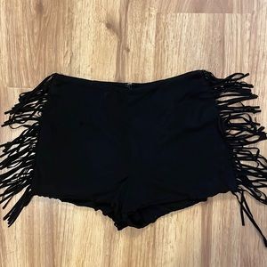 Black faux suede hot pants with fringe